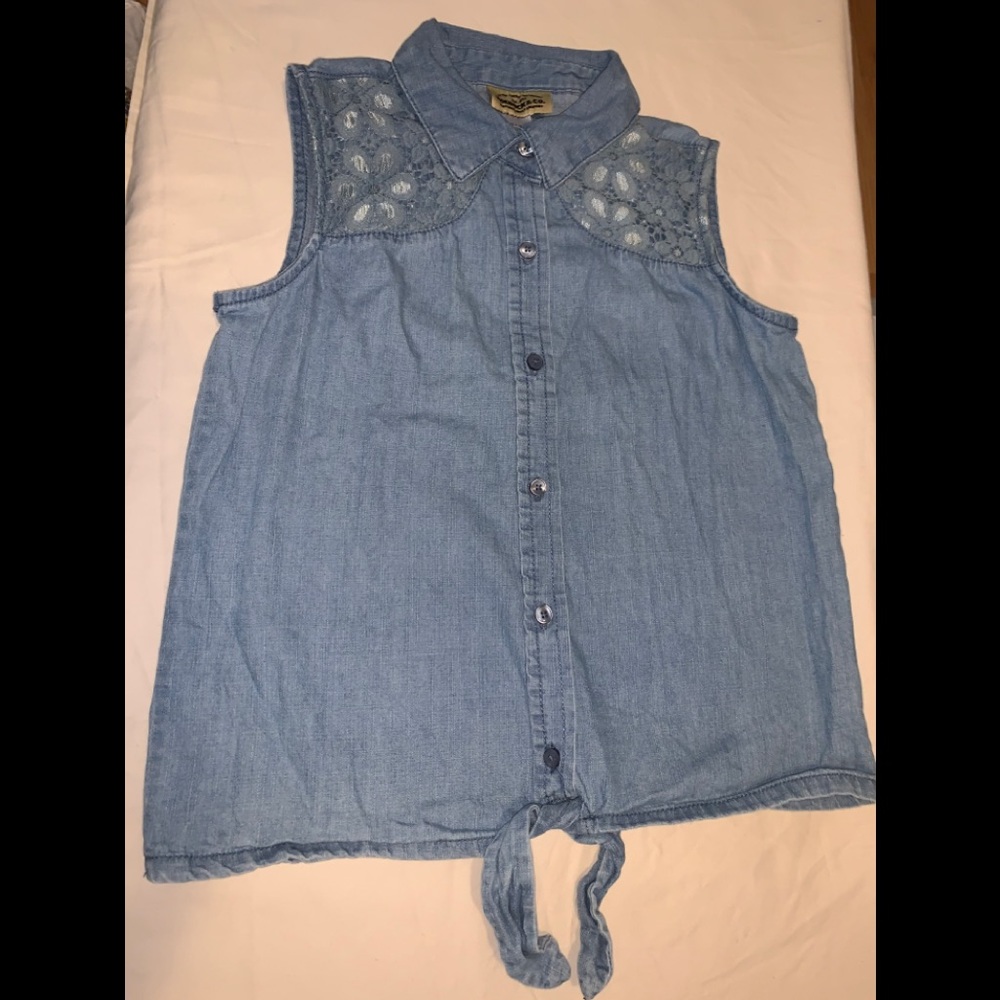 Girls denim sleeveless shirt with tie front.